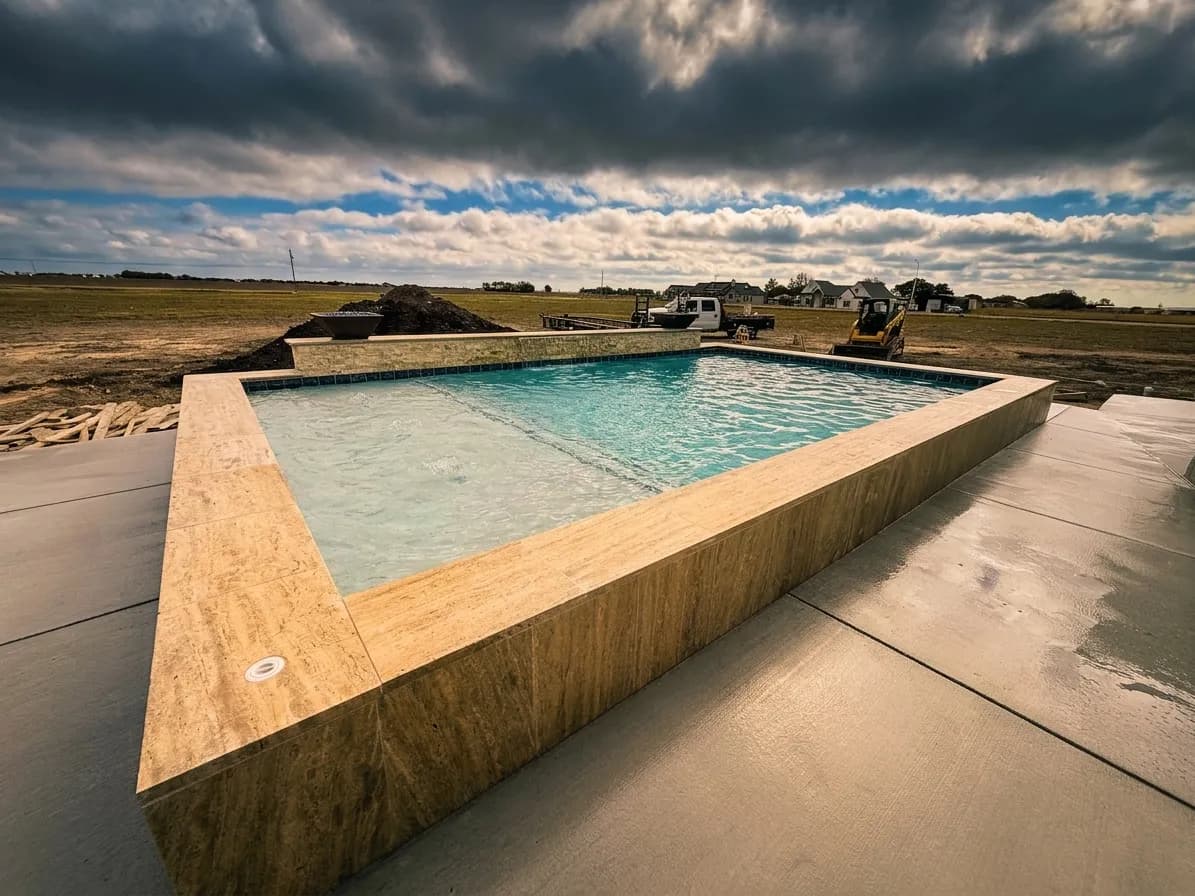 Custom home under construction in Seguin with the pool built alongside it
