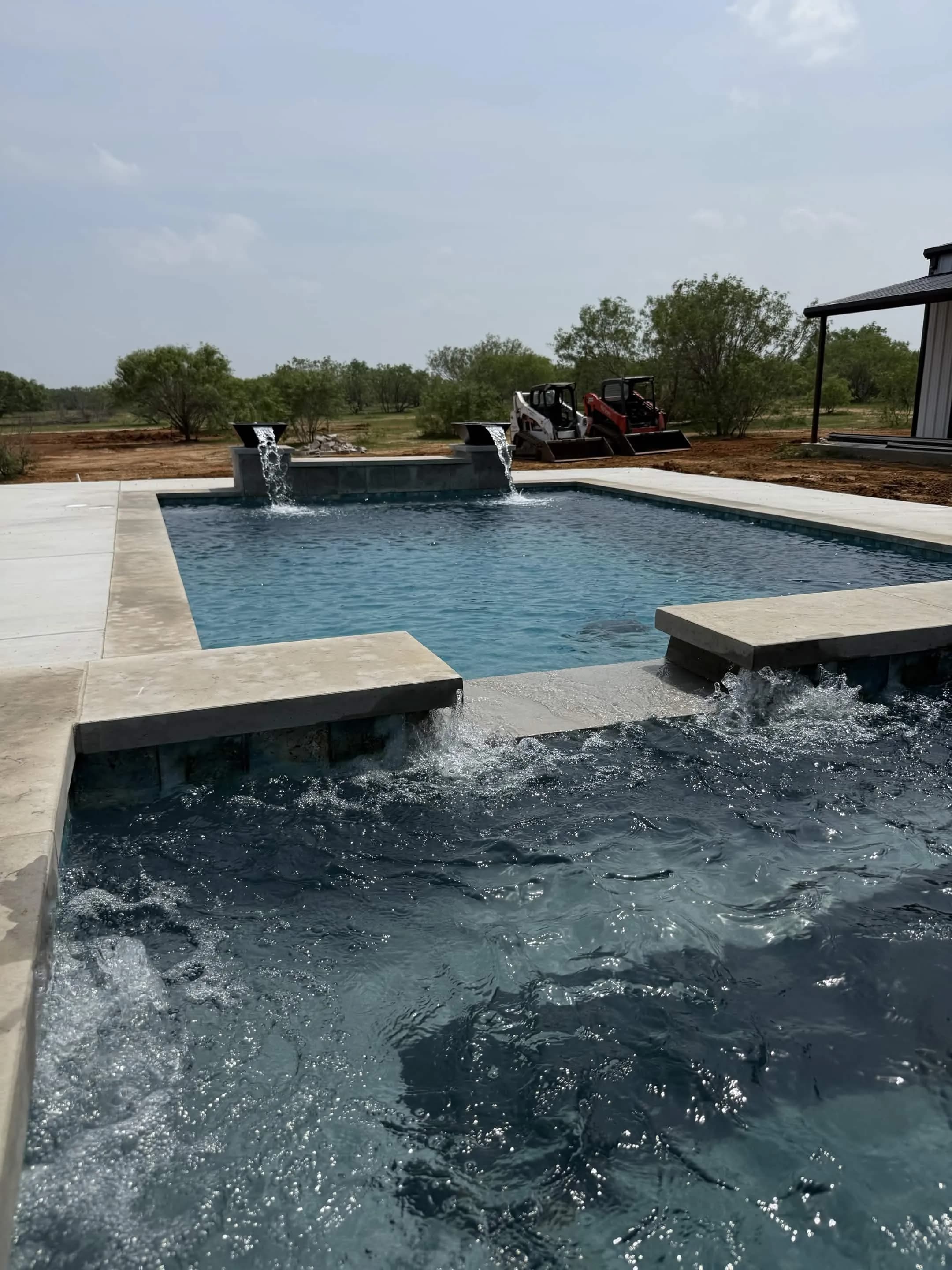 Gunite pool with built-in water feature