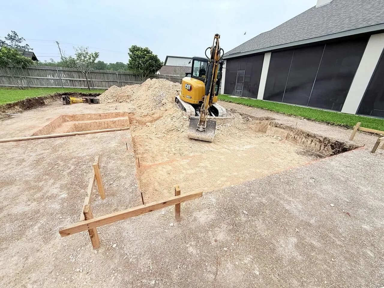 Pool excavation through Hill Country limestone and caliche