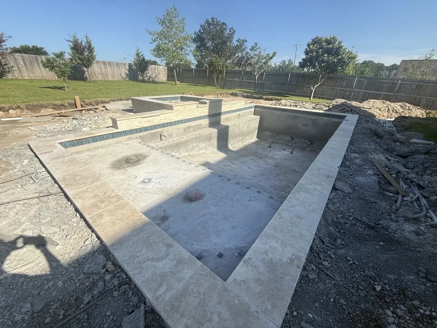 Pre-plaster gunite pool shell and spa, showing the double-mat steel framework before finishing