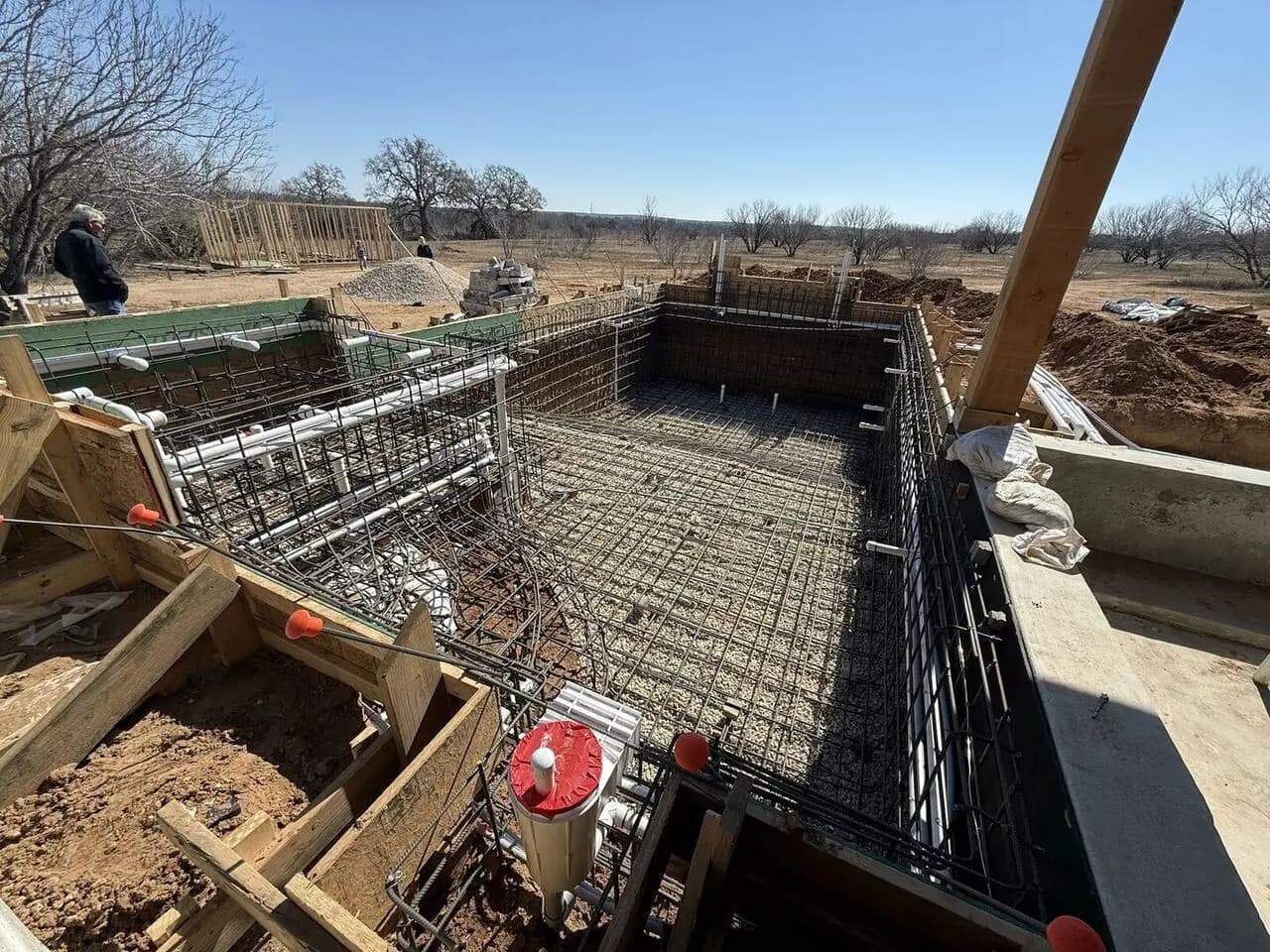 Steel rebar framework tied for a custom gunite pool shell